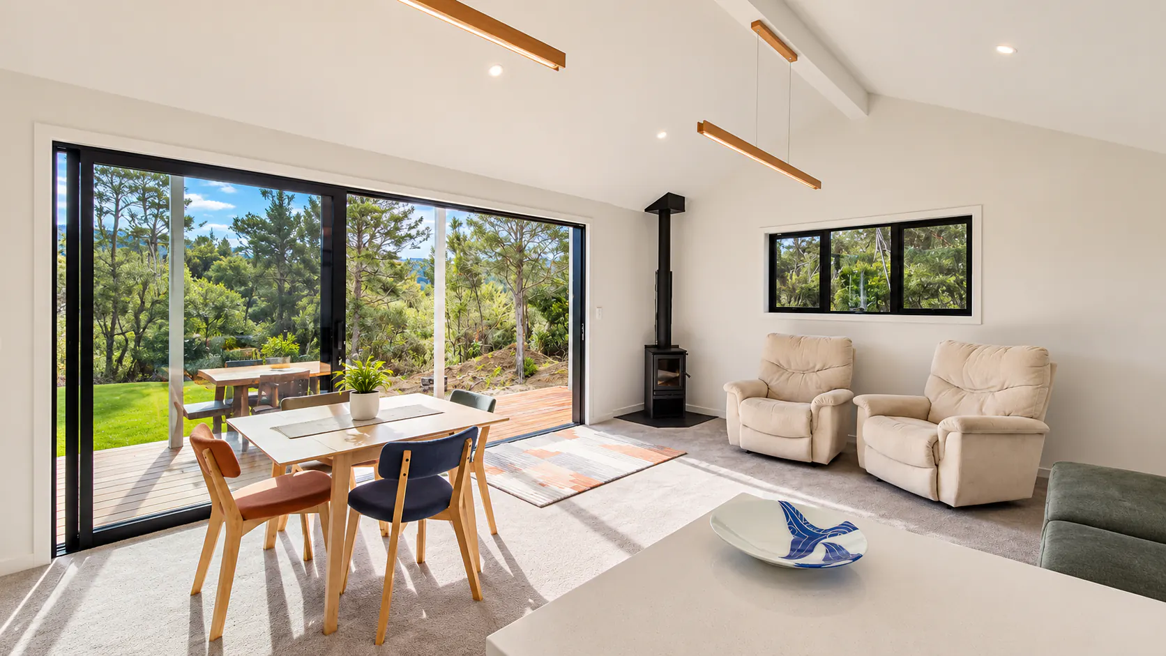 bach living room forest views sandy bay motueka nz