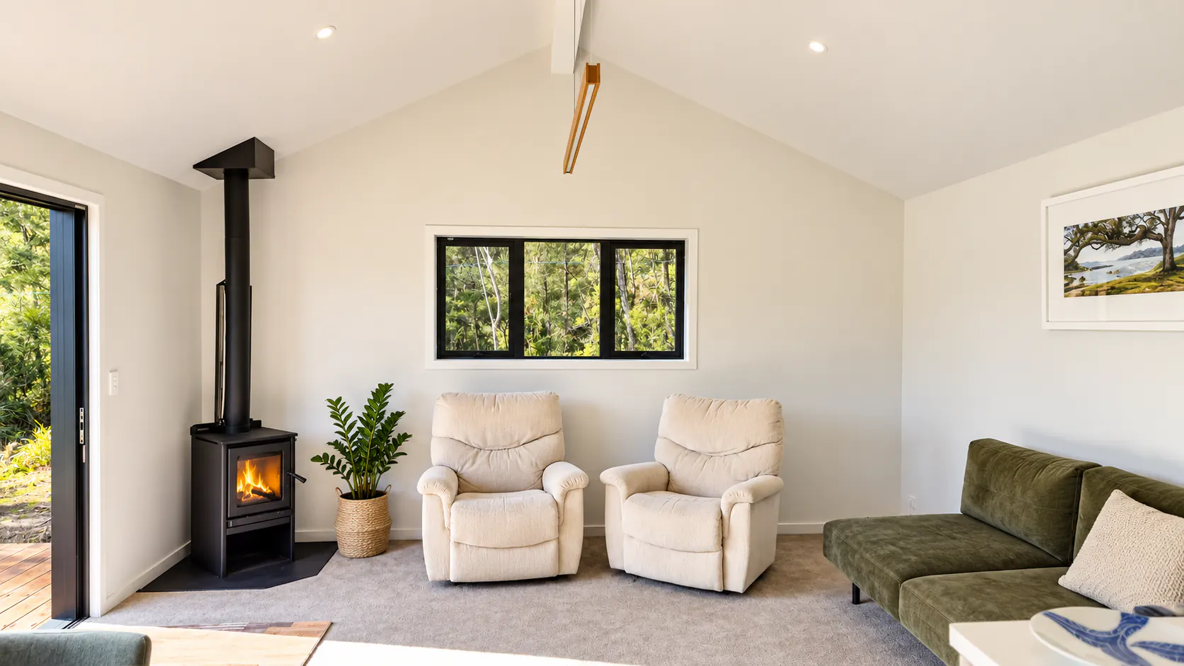 bach living room wood burner vaulted ceiling sandy bay motueka nz