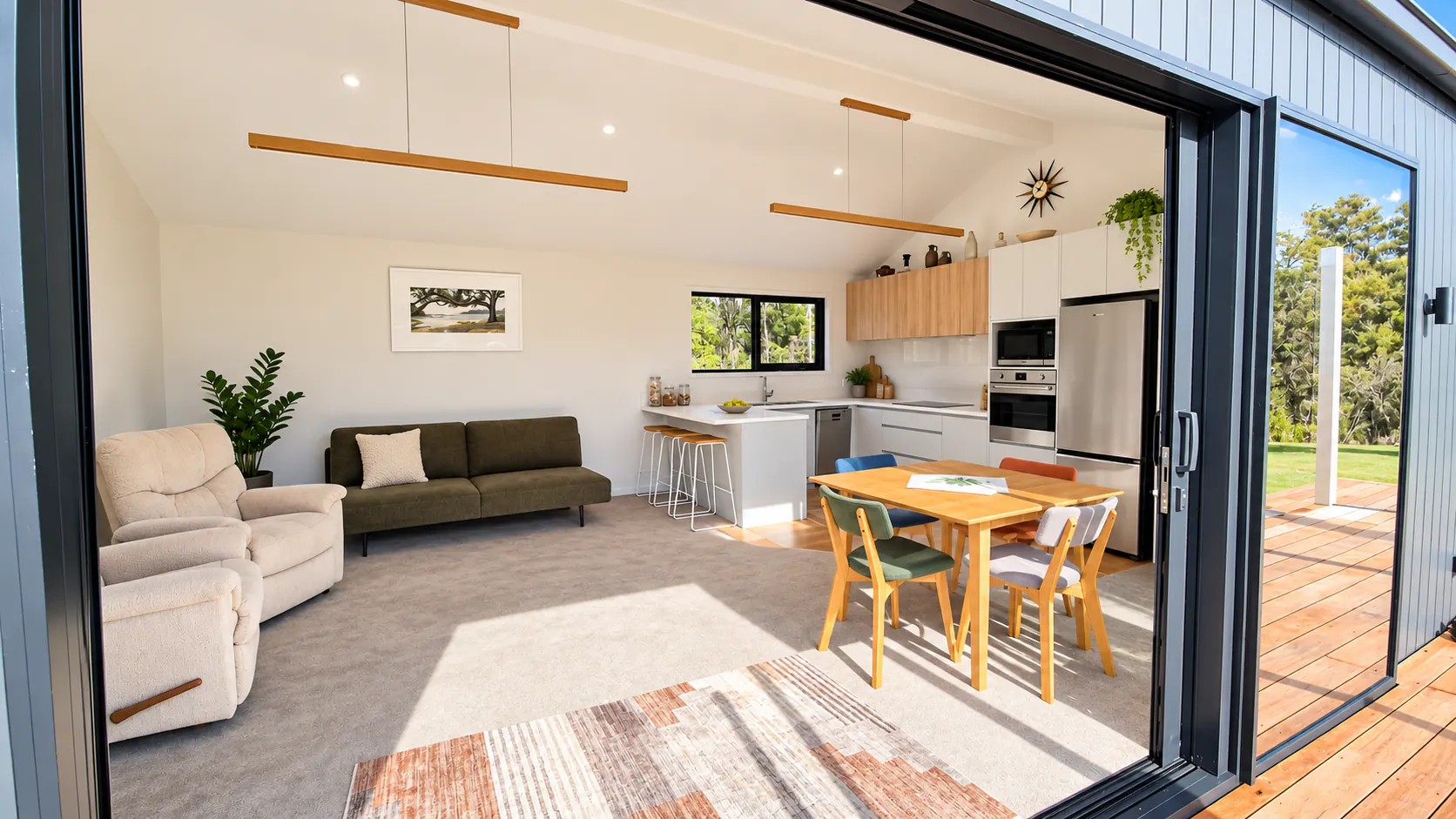 bach open plan living kitchen feature door sandy bay motueka nz