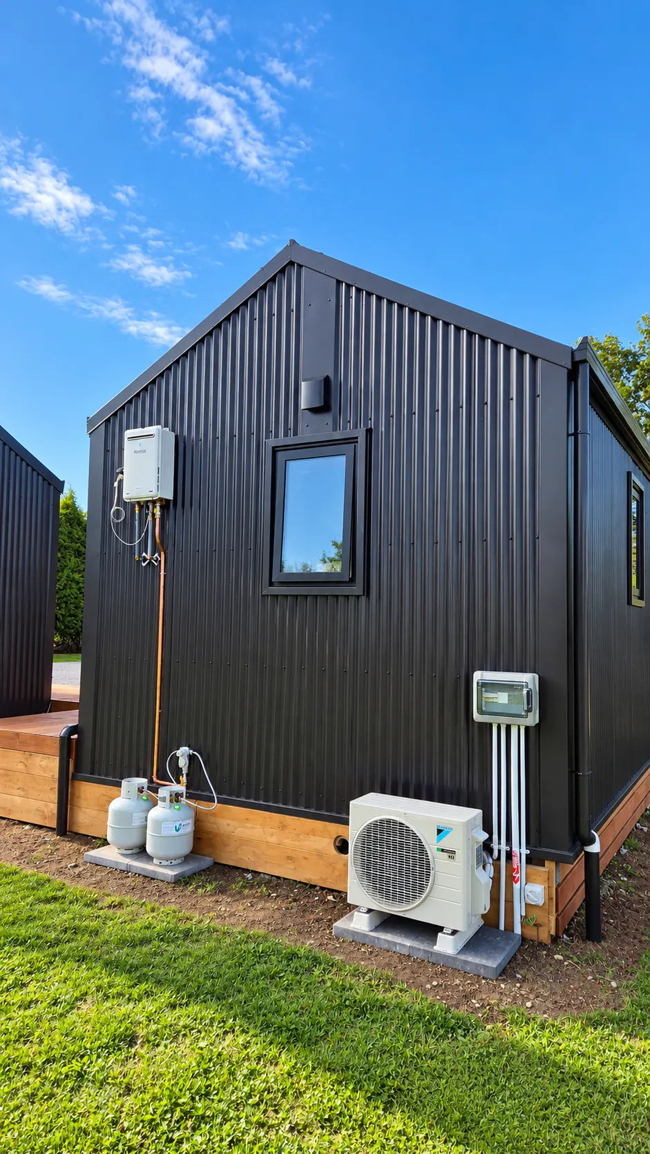 black office cabin end wall heat pump services nz