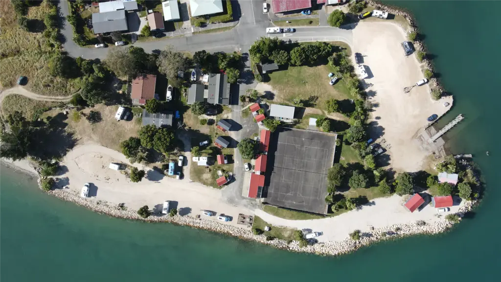 Aerial view of Collingwood Holiday Park beside the sea in Golden Bay