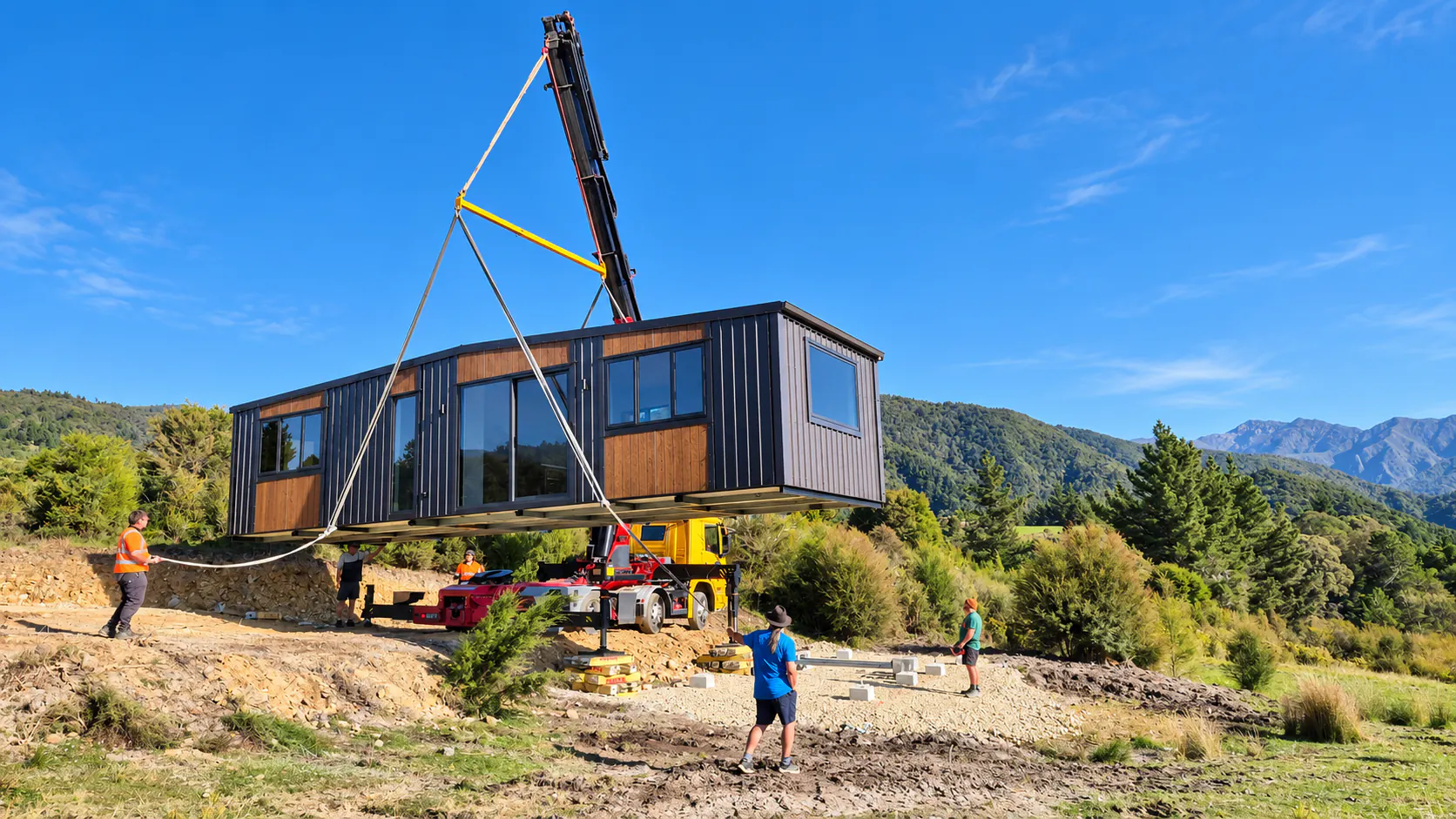 crane lifting custom tiny home mountain valley takaka hill nz
