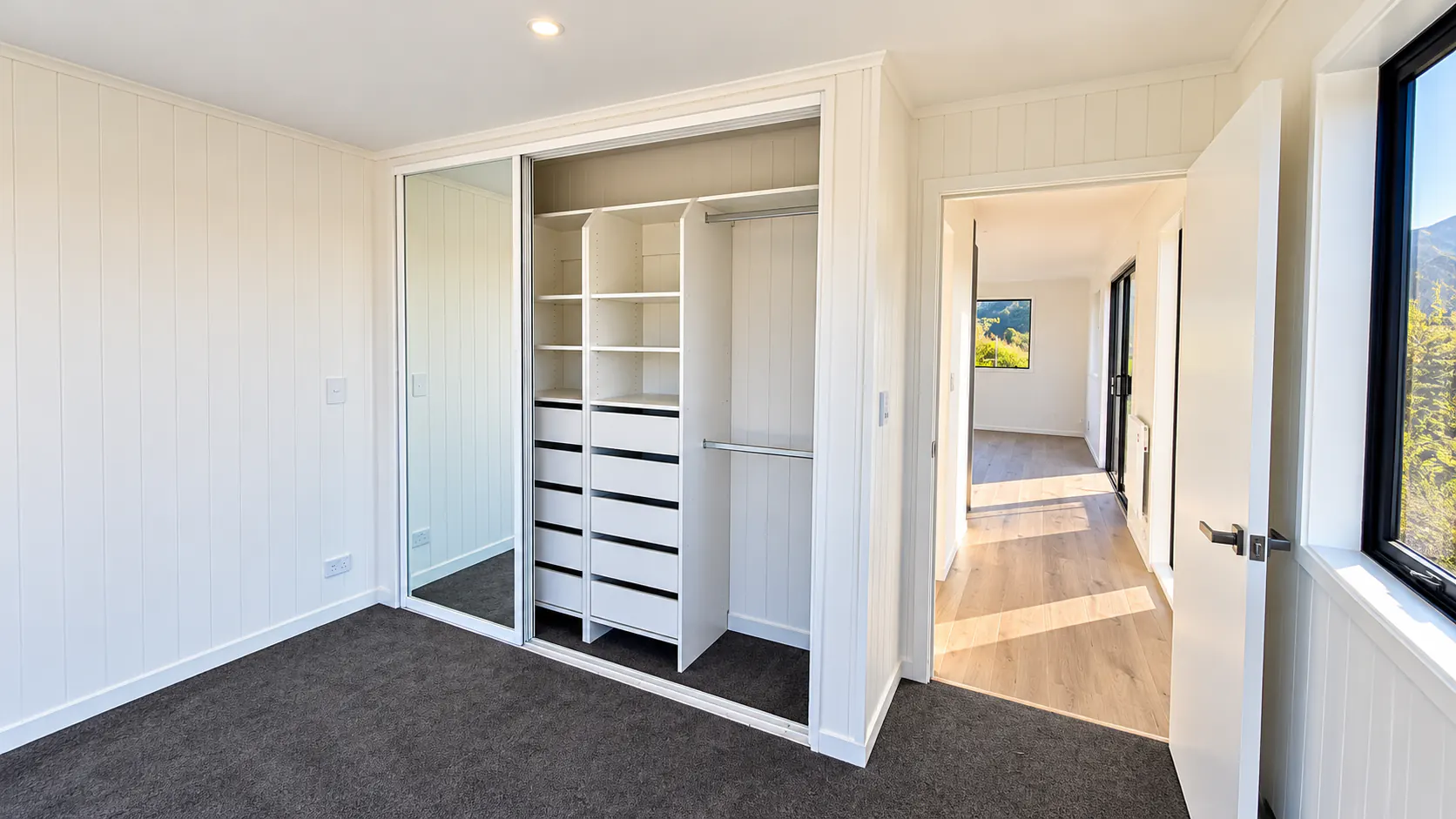 custom tiny home bedroom mirrored wardrobe takaka hill nz