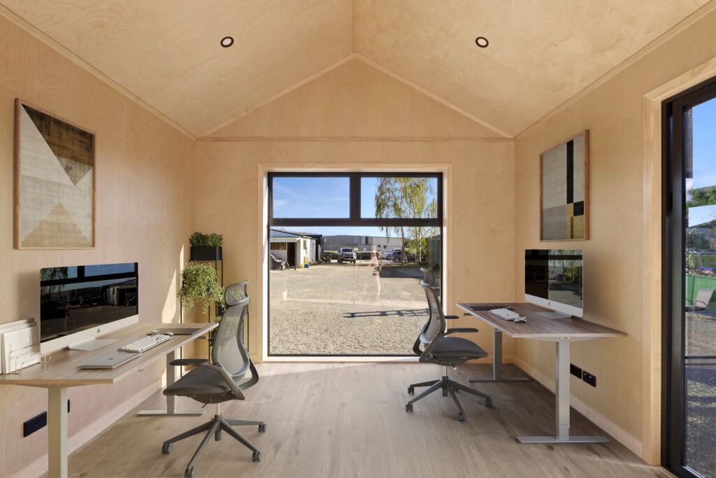 Two desks inside a transportable office cabin