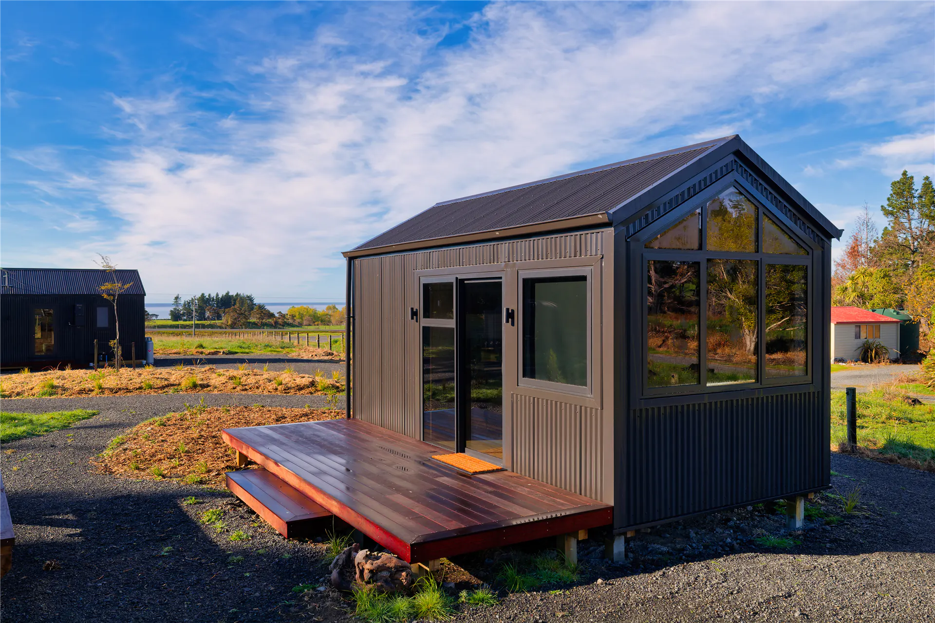 kaikoura tiny cabin timber deck glass doors nz