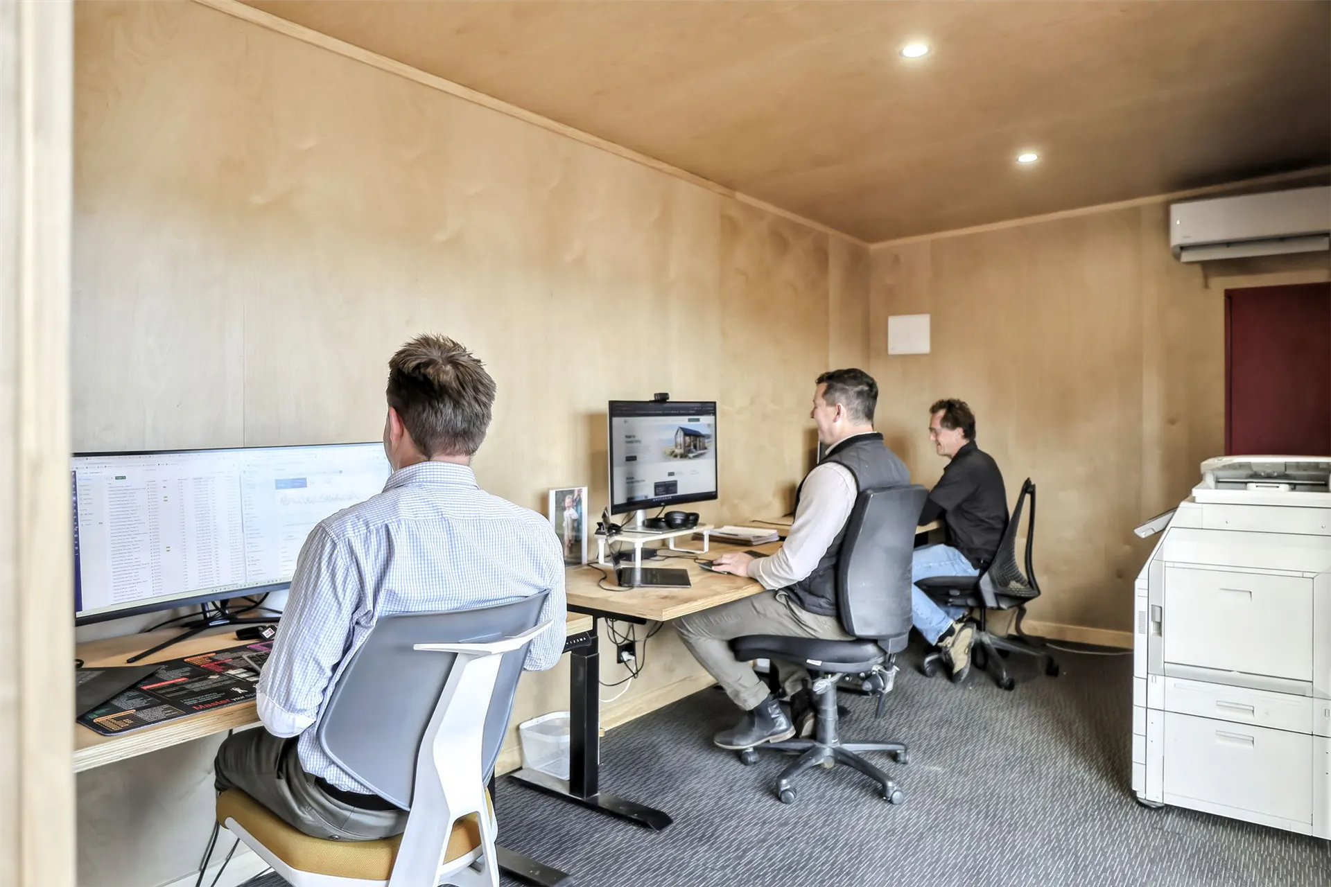 office show home three desk workspace staff at work