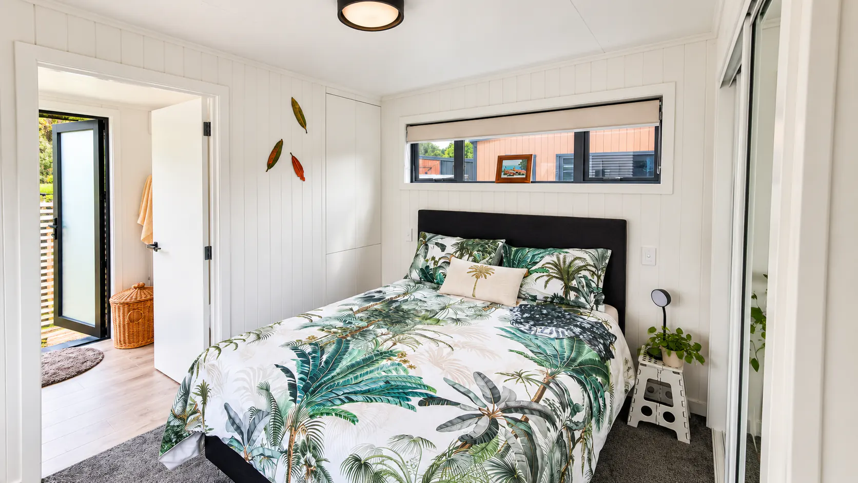 tiny home bedroom tropical bedding window bethany park kaiteriteri nz