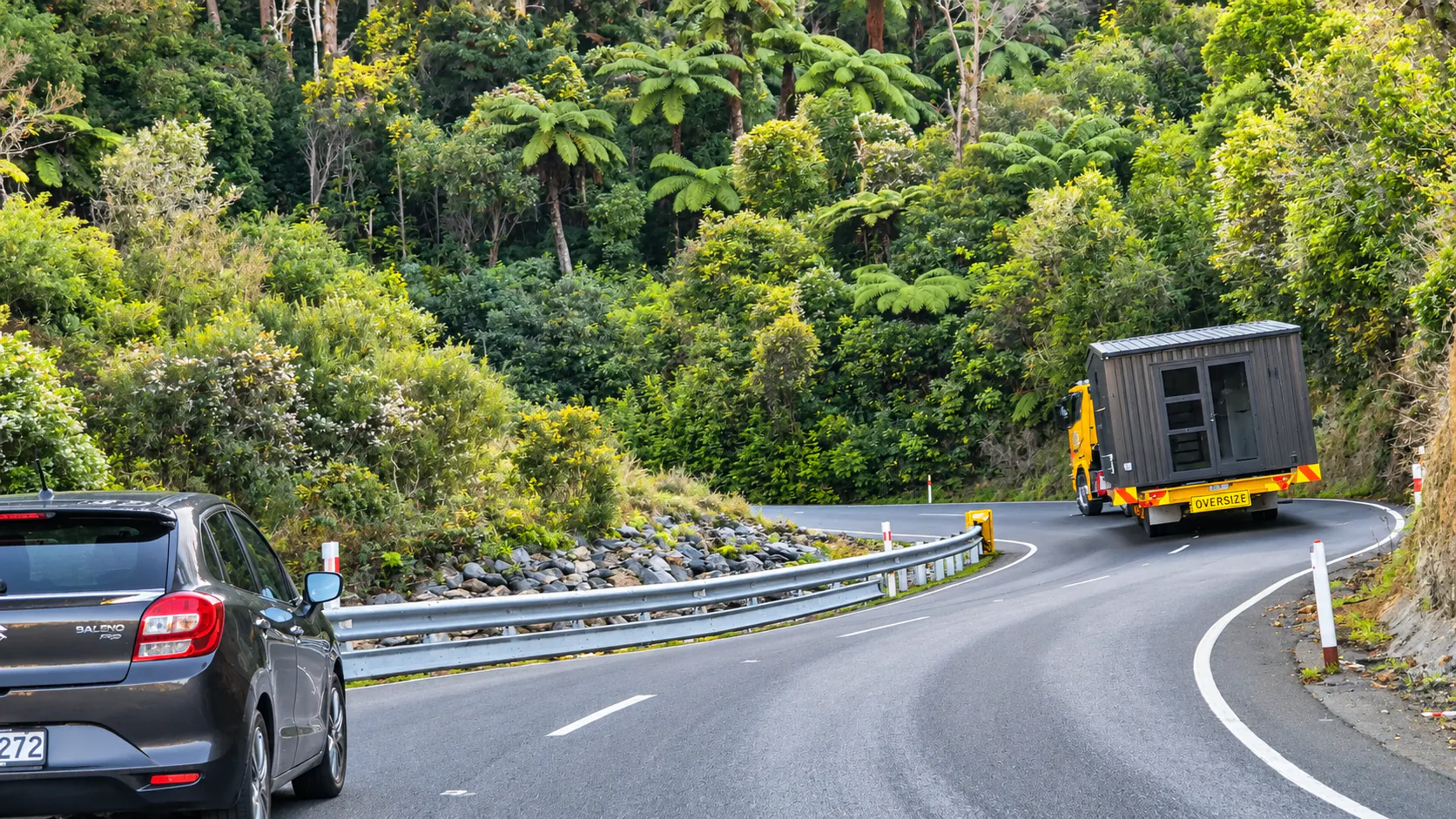 tiny home transport winding forest road takaka hill nz